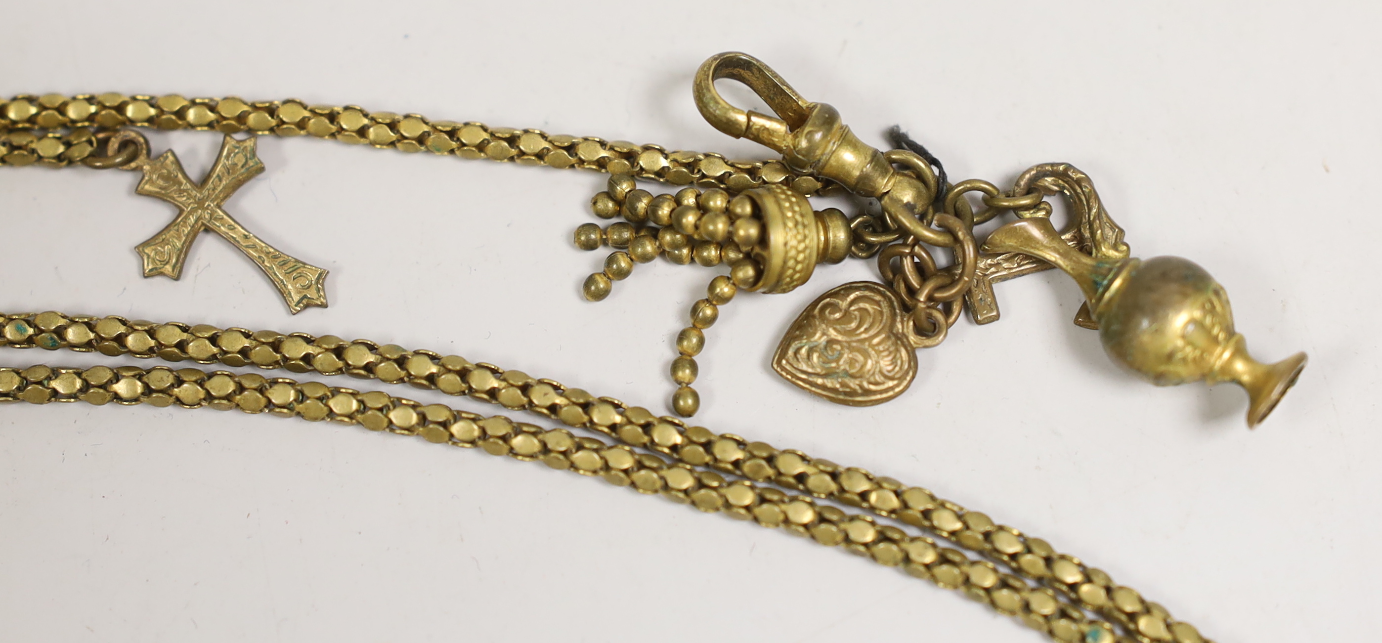 A 19th century yellow metal overlaid and bloodstone set fob seal, 22mm, on a yellow metal mounted black sash, a similar gilt metal guard chain and mourning pendant and a Regency seed pearl bracelet.